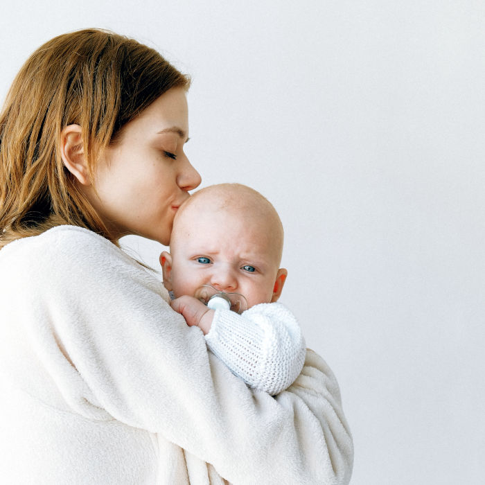 lady kissing baby